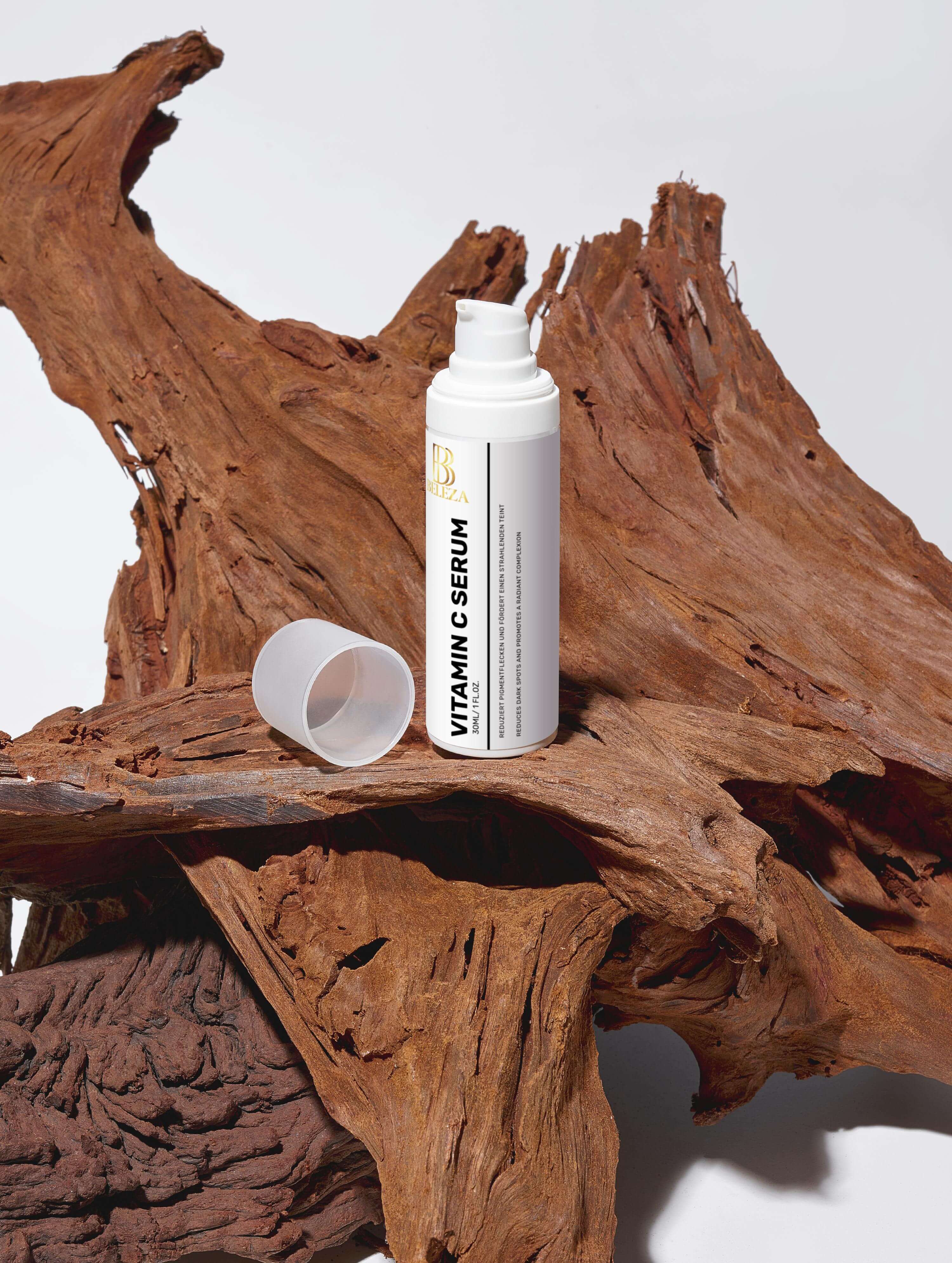 Vitamin C Serum bottle on a wooden surface, promoting radiant and fresh skin with natural ingredients.